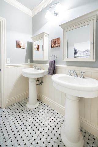 a bathroom with a sink toilet and mirror