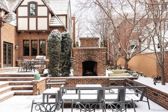 a view of house with outdoor seating and city view