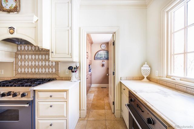 a kitchen with a stove and a cabinet