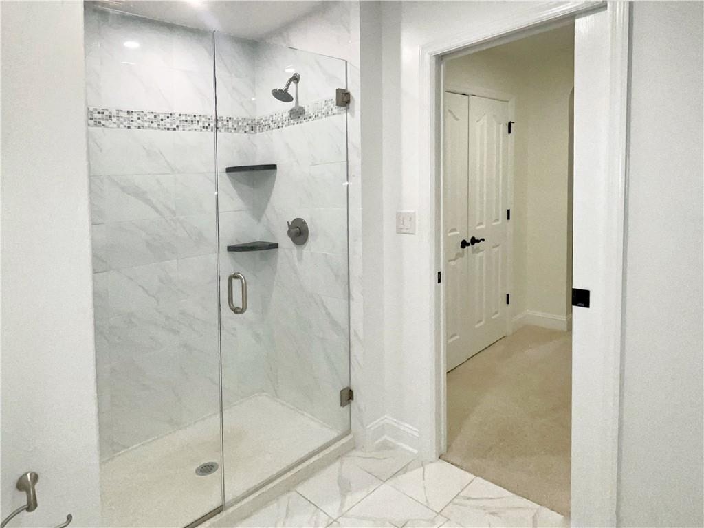 207 Adams Pointe Boulevard, Unit 6 Mars, PA 16046 - Photo 14 of 22 a bathroom with a glass shower door