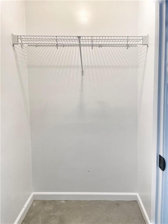 207 Adams Pointe Boulevard, Unit 6 Mars, PA 16046 - Photo 20 of 22 a view of a room with racks on the wall