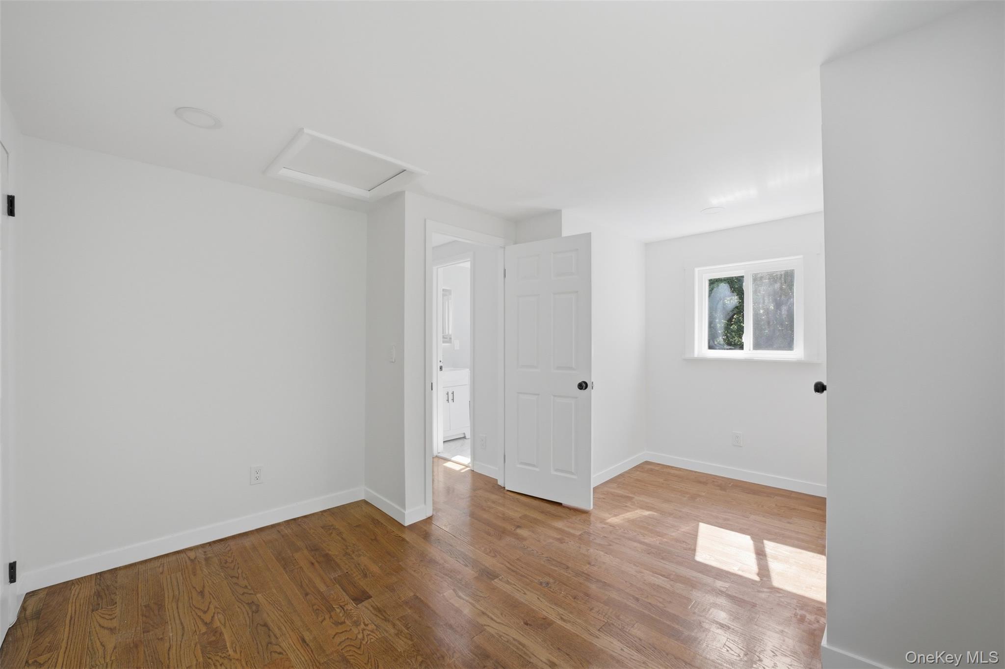 24 Fuller Road Ossining, NY 10562 - Photo 30 of 48 a view of an empty room with wooden floor and a window
