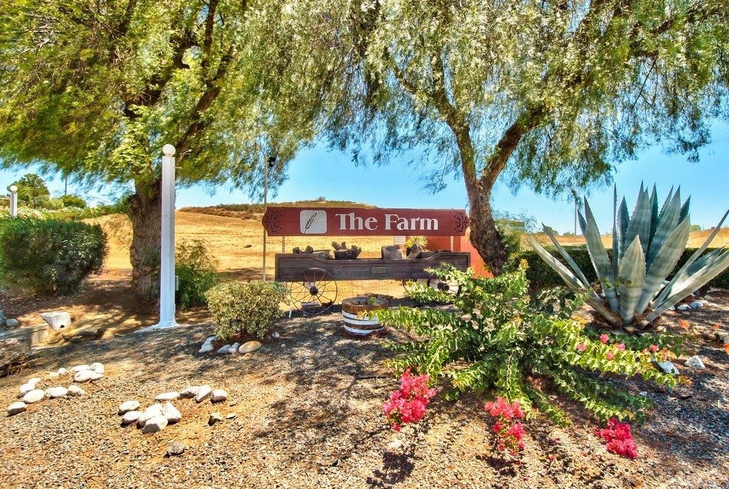 33733 Plowshare Road Wildomar, CA 92595 - Photo 38 of 38 a sign that is sitting in front of flowers
