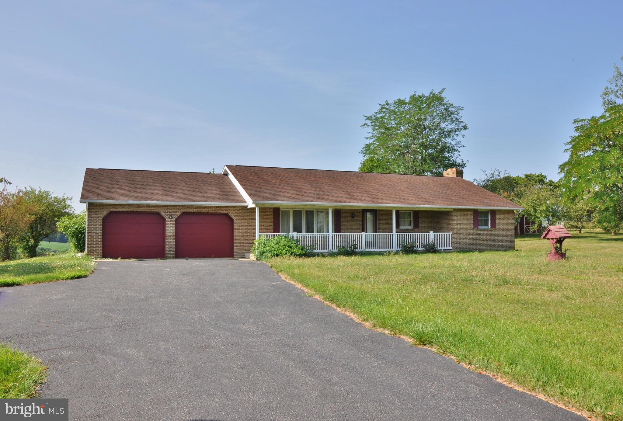 3000 Jefferson Road Spring Grove, PA 17362 - Photo 1 of 63 a front view of a house with a yard and garage