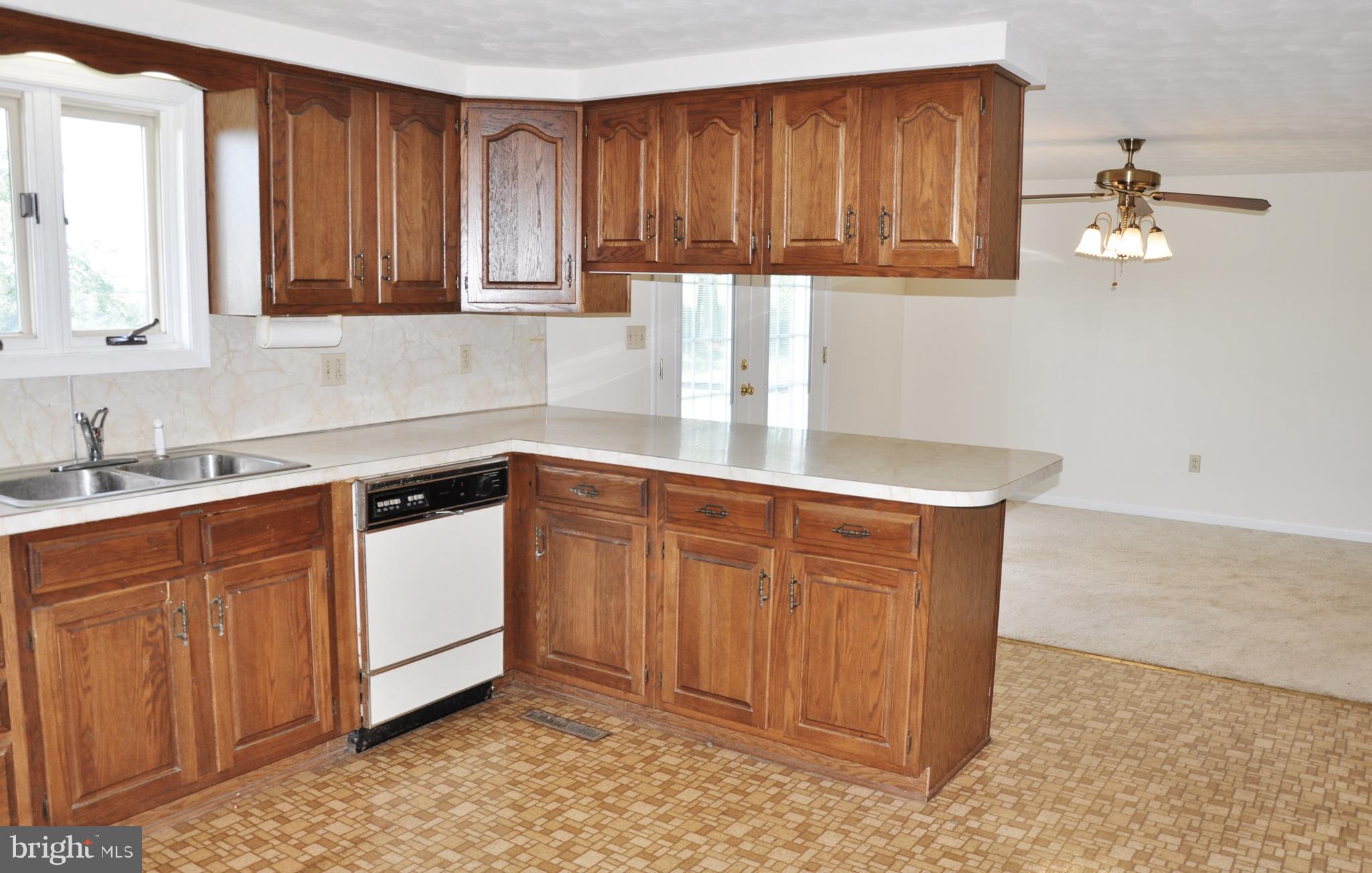 3000 Jefferson Road Spring Grove, PA 17362 - Photo 13 of 63 a kitchen with stainless steel appliances granite countertop wooden cabinets a sink and dishwasher