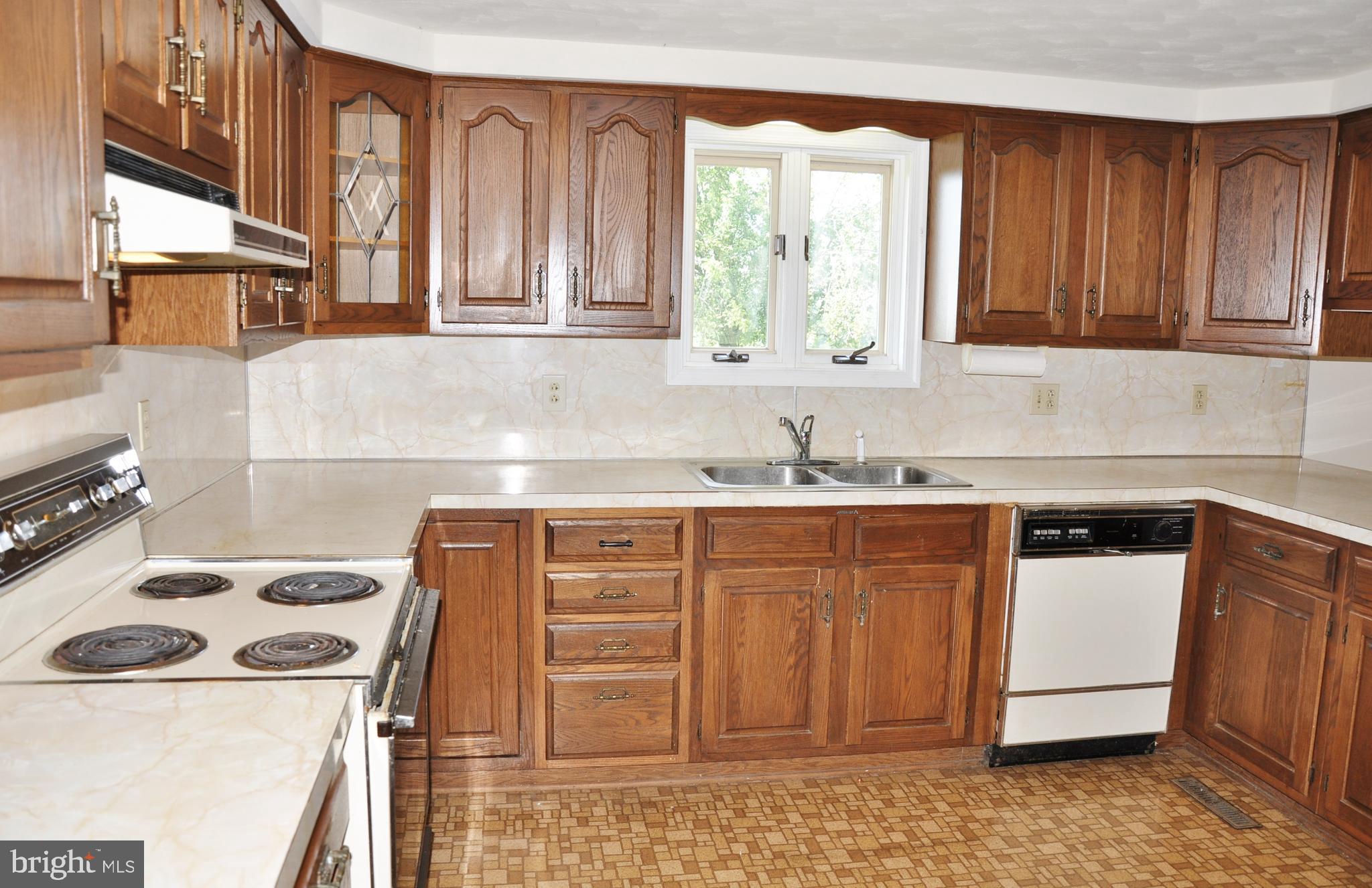 3000 Jefferson Road Spring Grove, PA 17362 - Photo 14 of 63 a kitchen with granite countertop a sink a stove and cabinets