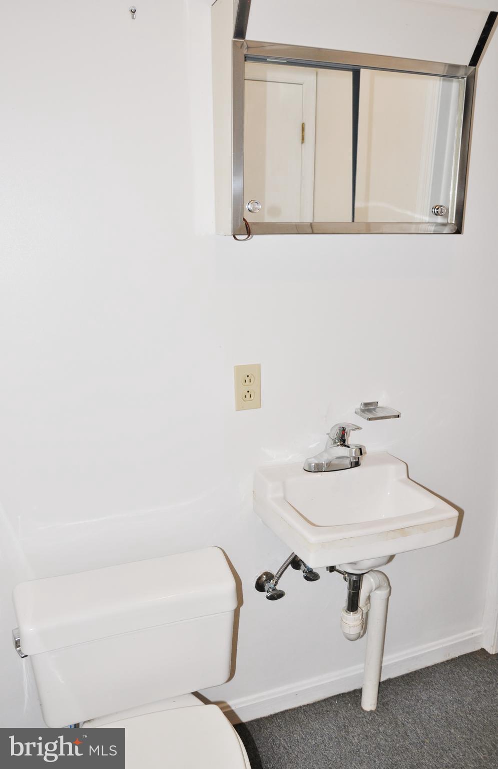 3000 Jefferson Road Spring Grove, PA 17362 - Photo 33 of 63 a bathroom with a sink a toilet and mirror