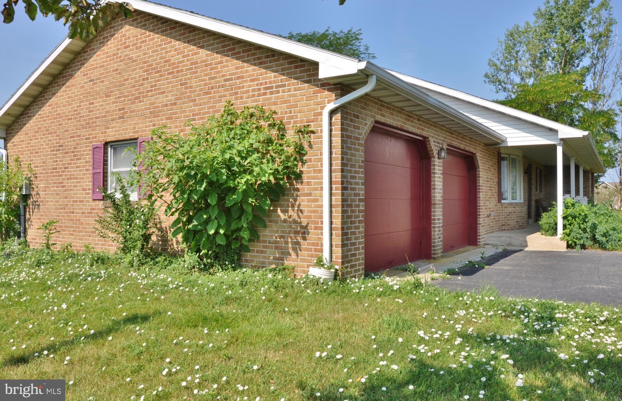 3000 Jefferson Road Spring Grove, PA 17362 - Photo 62 of 63 a view of a house with brick walls and a yard with plants