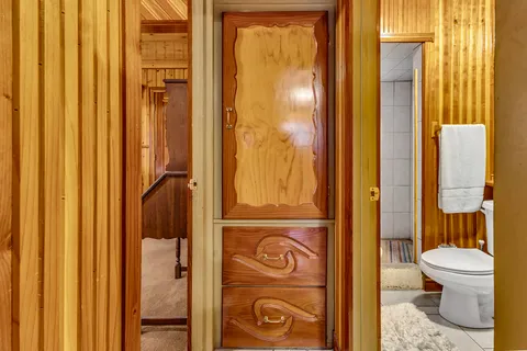 a bathroom with a toilet and shower