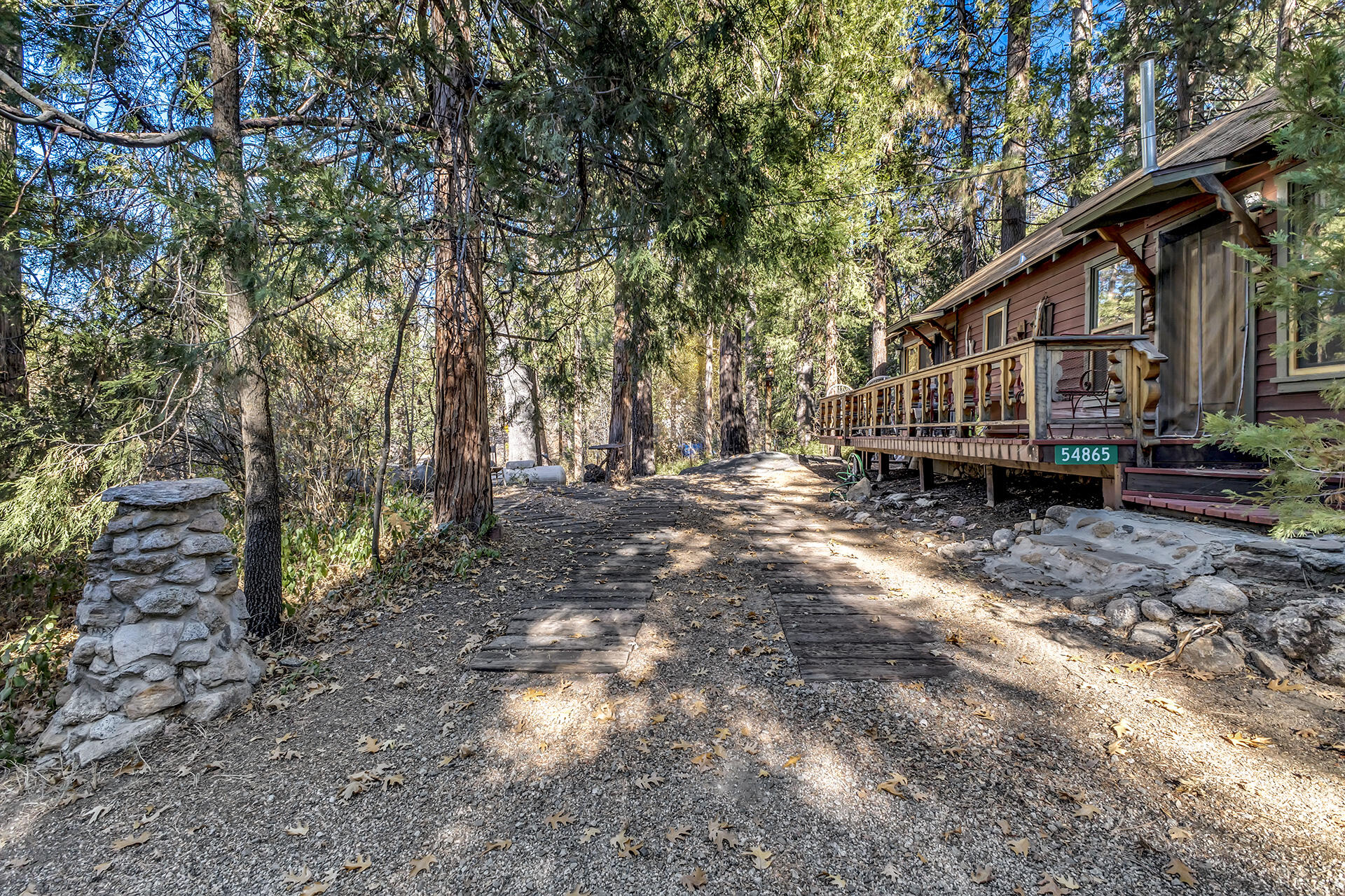 54865 Strong Drive Idyllwild, CA 92549 - Photo 2 of 27 a backyard of a house with lots of green space