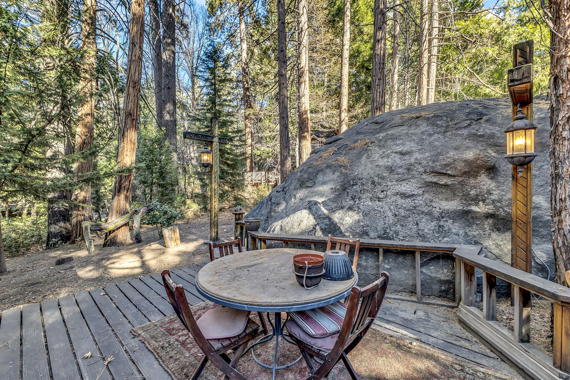 54865 Strong Drive Idyllwild, CA 92549 - Photo 24 of 27 a backyard of a house with table and chairs