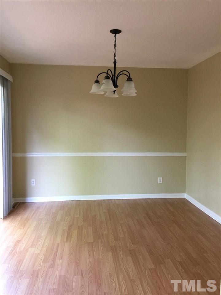 1034 Randolph Court Cary, NC 27511 - Photo 3 of 14 a view of a room with wooden floor and white walls