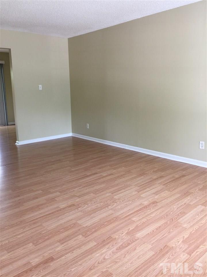 1034 Randolph Court Cary, NC 27511 - Photo 4 of 14 a view of an empty room with wooden floor