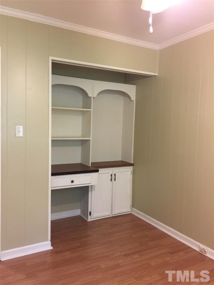 1034 Randolph Court Cary, NC 27511 - Photo 10 of 14 a room with cabinets and wooden floor