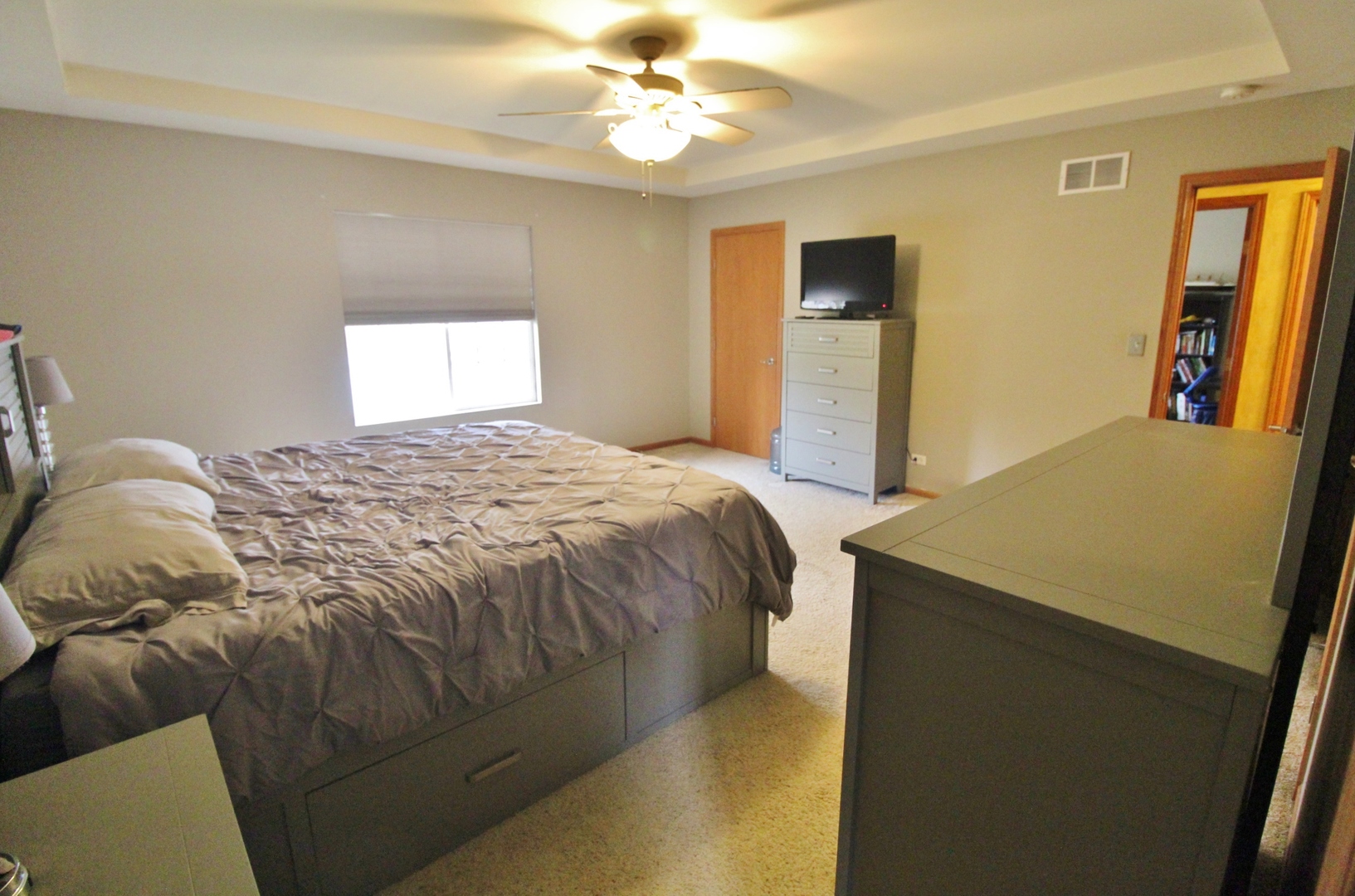 1445 Scott Circle Morris, IL 60450 - Photo 15 of 31 a bedroom with a bed and a chandelier