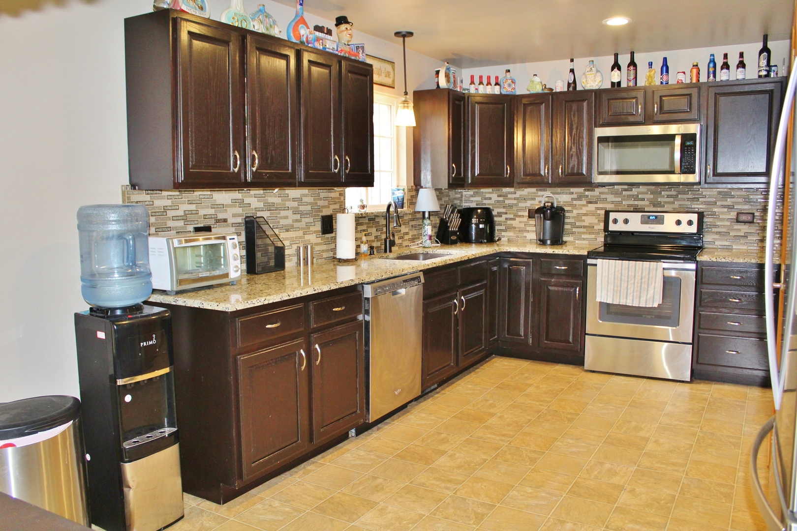 1445 Scott Circle Morris, IL 60450 - Photo 7 of 31 a kitchen with stainless steel appliances granite countertop a stove microwave and sink