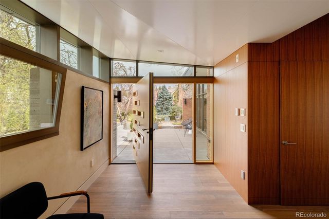 a bathroom with a granite countertop sink a toilet and a mirror