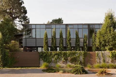 an aerial view of a house with a lake view