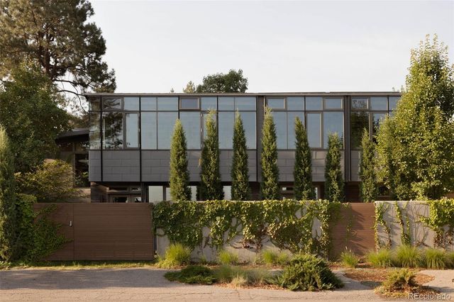 an aerial view of a house with a lake view