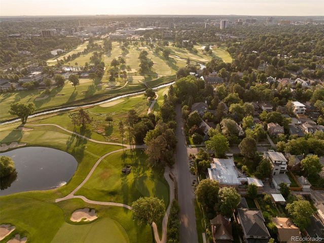 a view of a hallway with windows and stairs
