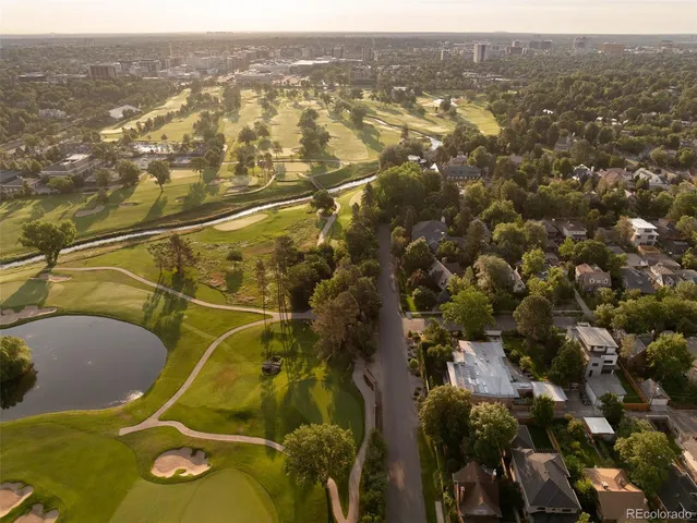 a view of a hallway with windows and stairs