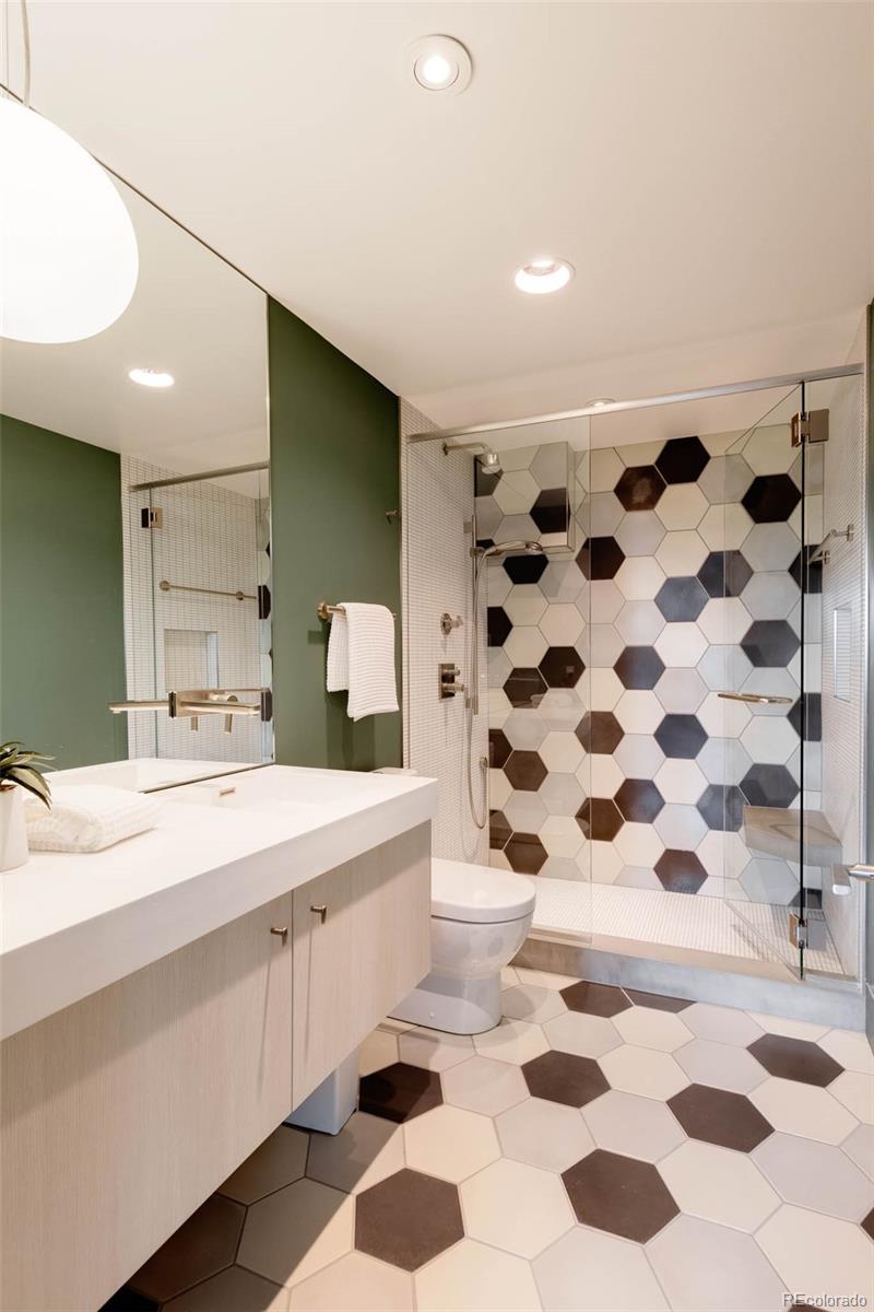 101 South Humboldt Street Denver, CO 80209 - Photo 46 of 50 a bathroom with a sink a toilet a shower and a mirror