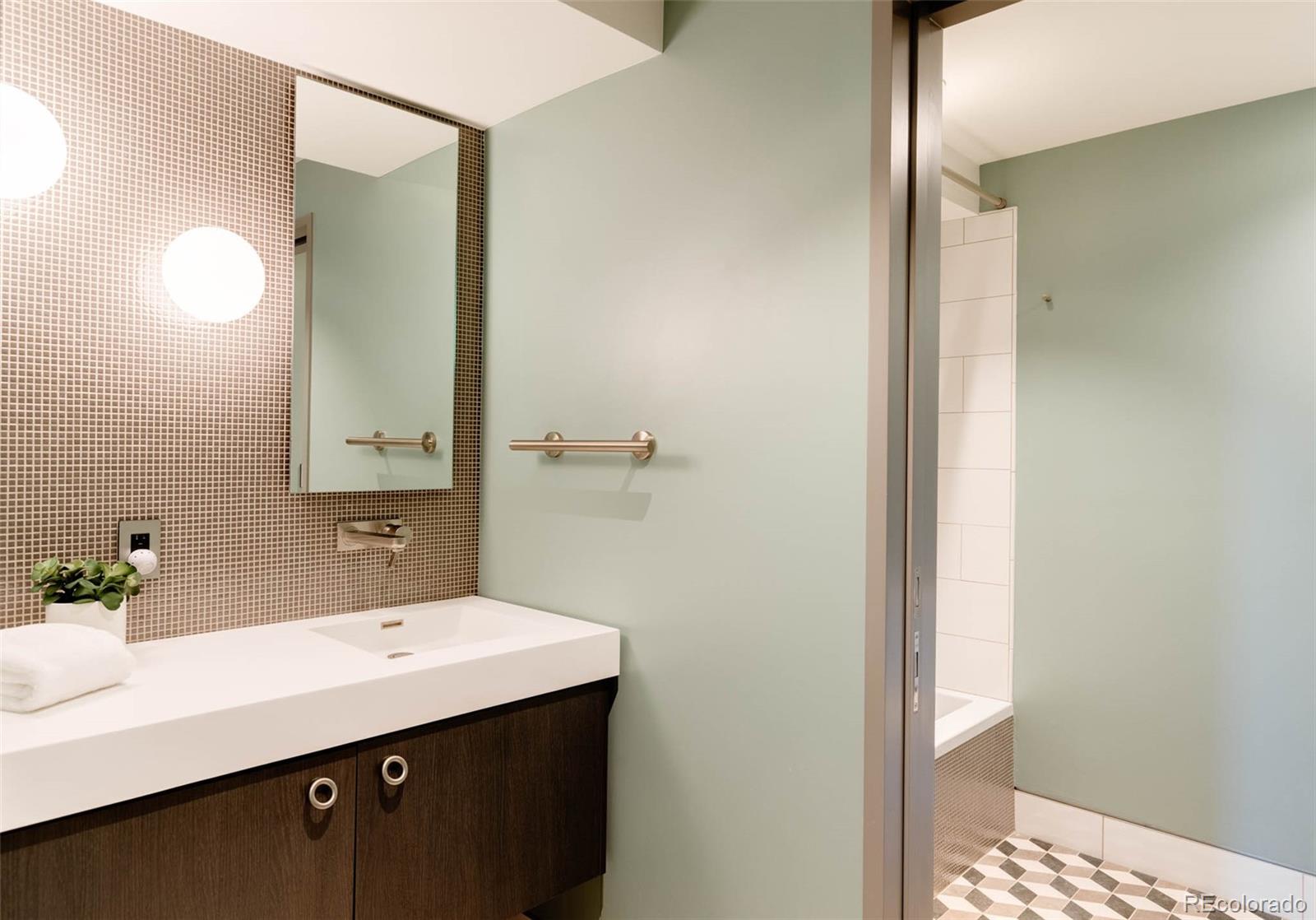 101 South Humboldt Street Denver, CO 80209 - Photo 47 of 50 a bathroom with a sink and a mirror