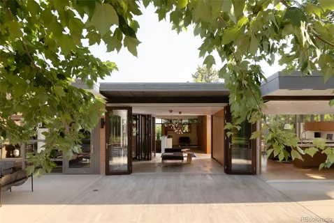 a dining room with furniture and wooden floor