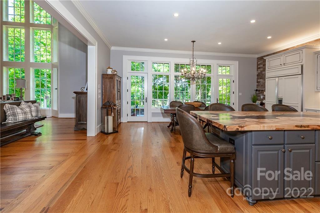 146 Allison Creek Trail Brevard, NC 28712 - Photo 12 of 48 a view of a dining room with furniture window and wooden floor