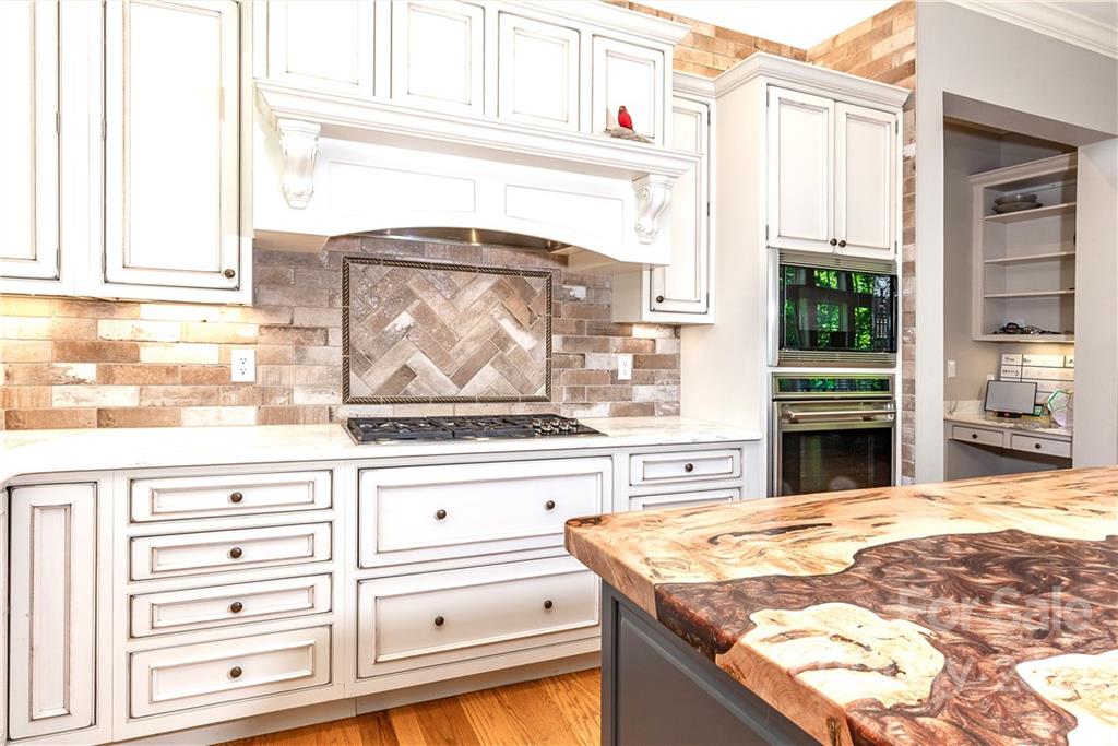 146 Allison Creek Trail Brevard, NC 28712 - Photo 13 of 48 a kitchen with a stove and a white cabinets