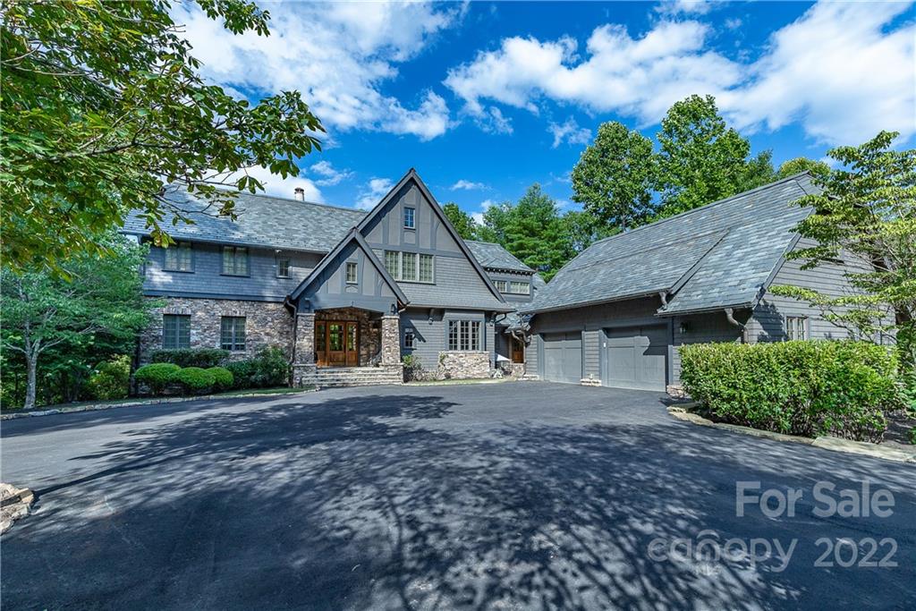 146 Allison Creek Trail Brevard, NC 28712 - Photo 2 of 48 a front view of a house with a garden