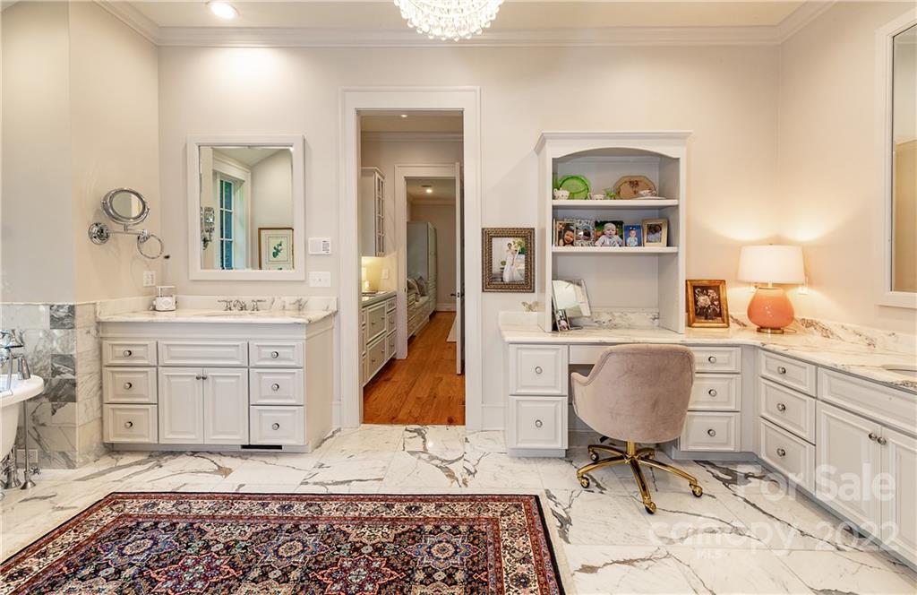 146 Allison Creek Trail Brevard, NC 28712 - Photo 25 of 48 a spacious bathroom with a granite countertop sink and a mirror