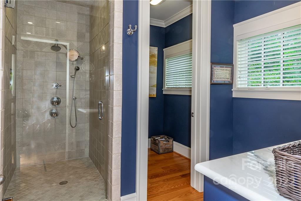 146 Allison Creek Trail Brevard, NC 28712 - Photo 30 of 48 a bathroom with a granite countertop shower and a sink