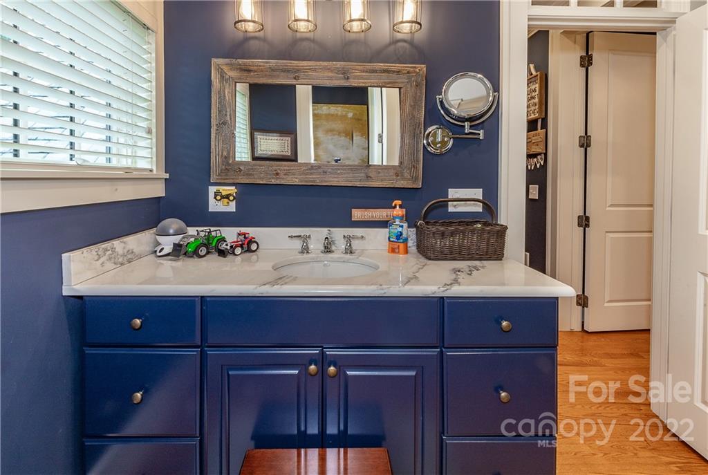 146 Allison Creek Trail Brevard, NC 28712 - Photo 31 of 48 a bathroom with a sink and a mirror