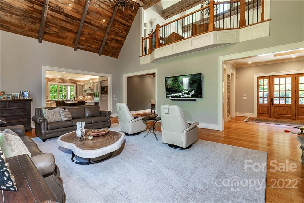 146 Allison Creek Trail Brevard, NC 28712 - Photo 4 of 48 a living room with furniture kitchen view and a flat screen tv