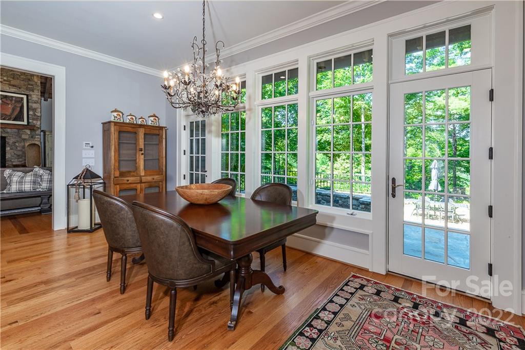 146 Allison Creek Trail Brevard, NC 28712 - Photo 10 of 48 a view of a dining room with furniture window and wooden floor
