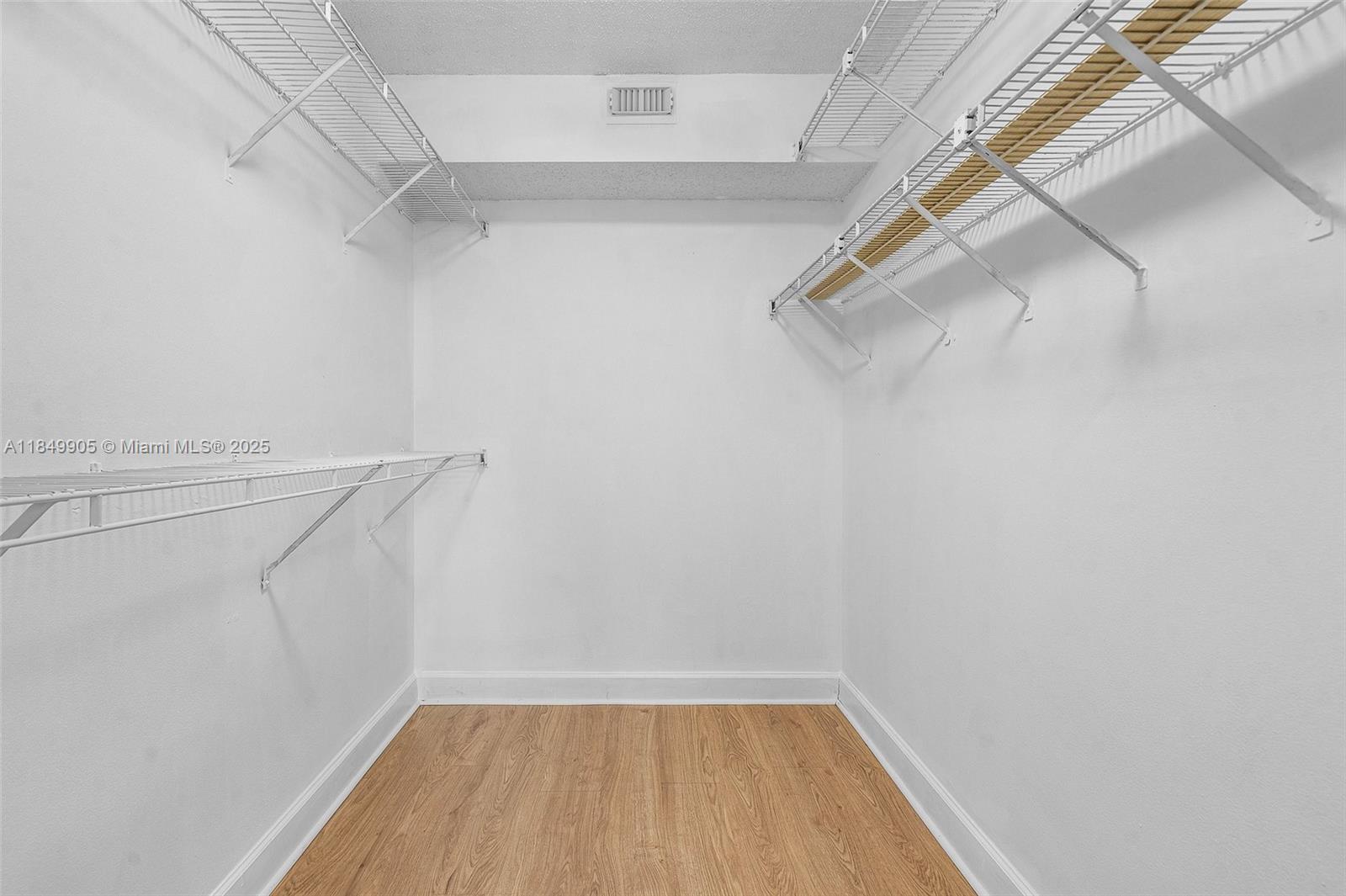 8721 Wiles Road, Unit 105 Coral Springs, FL 33067 - Photo 13 of 49 a view of a room with racks on the wall