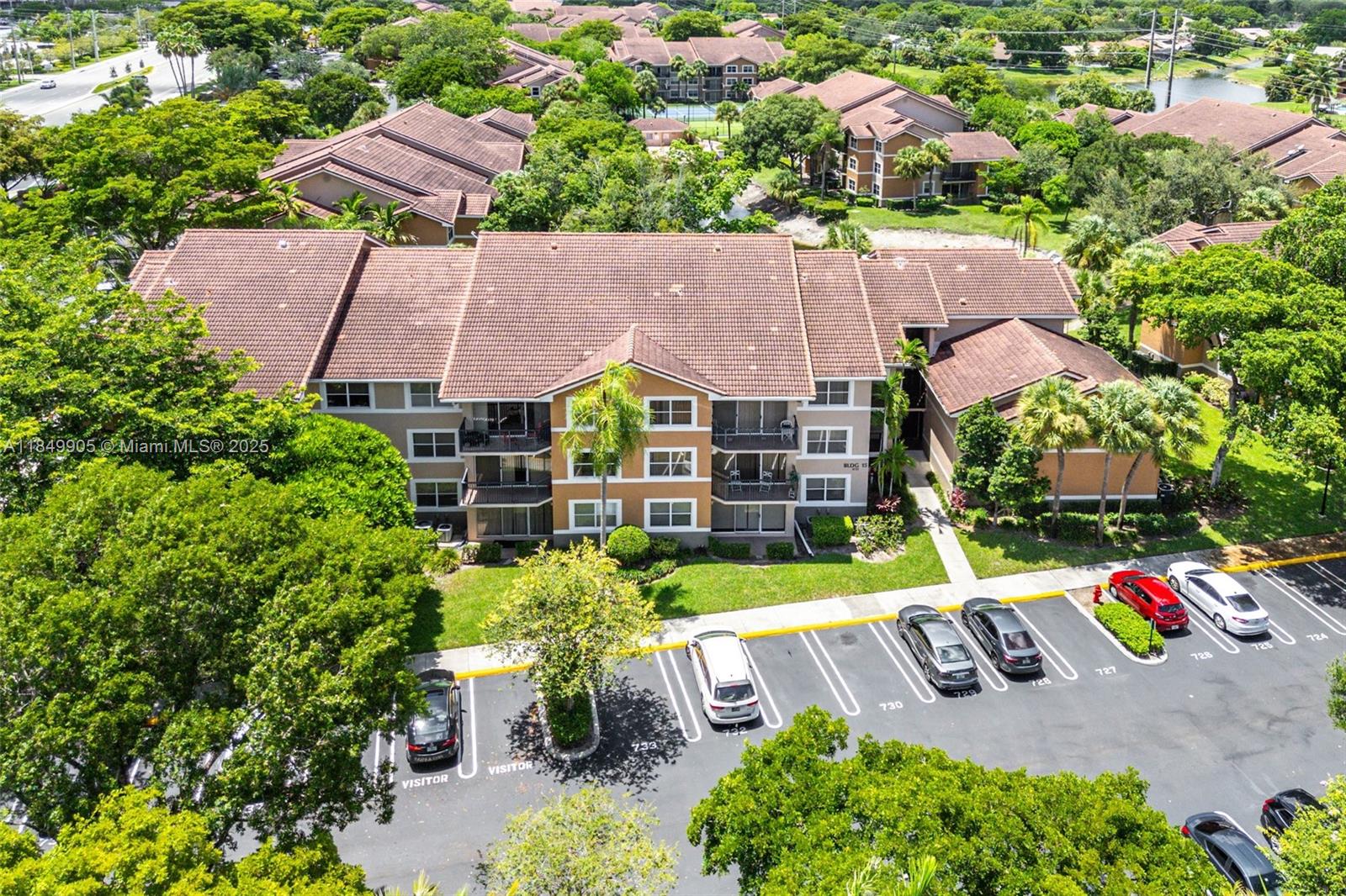 8721 Wiles Road, Unit 105 Coral Springs, FL 33067 - Photo 28 of 49 an aerial view of a house with a garden