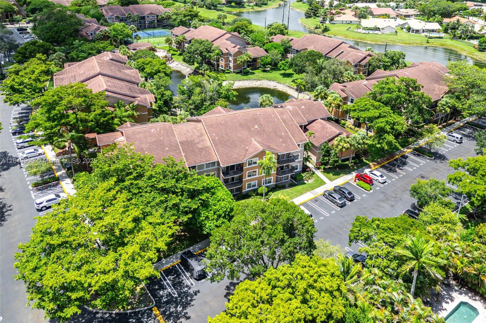 8721 Wiles Road, Unit 105 Coral Springs, FL 33067 - Photo 29 of 49 an aerial view of a house with a garden