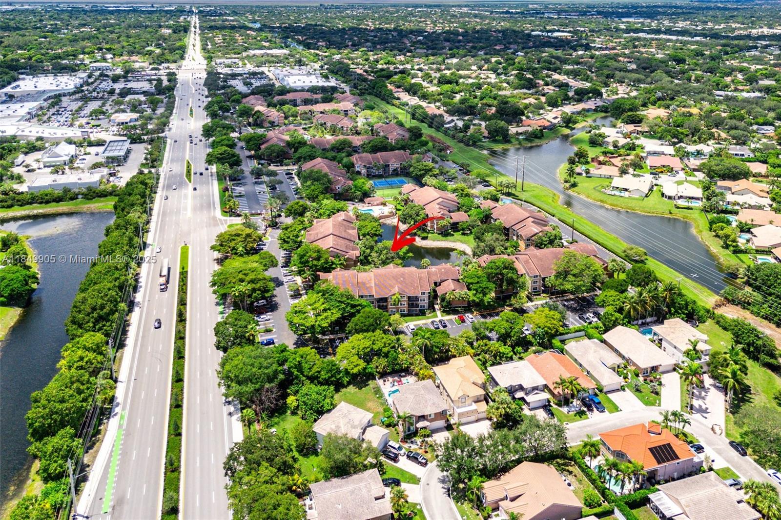 8721 Wiles Road, Unit 105 Coral Springs, FL 33067 - Photo 35 of 49 an aerial view of residential houses with outdoor space and trees all around