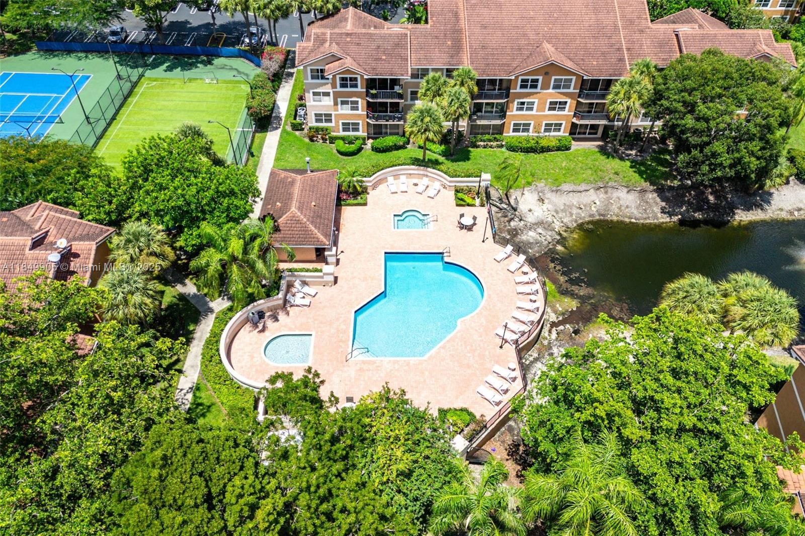 8721 Wiles Road, Unit 105 Coral Springs, FL 33067 - Photo 37 of 49 an aerial view of a house with a garden and lake view