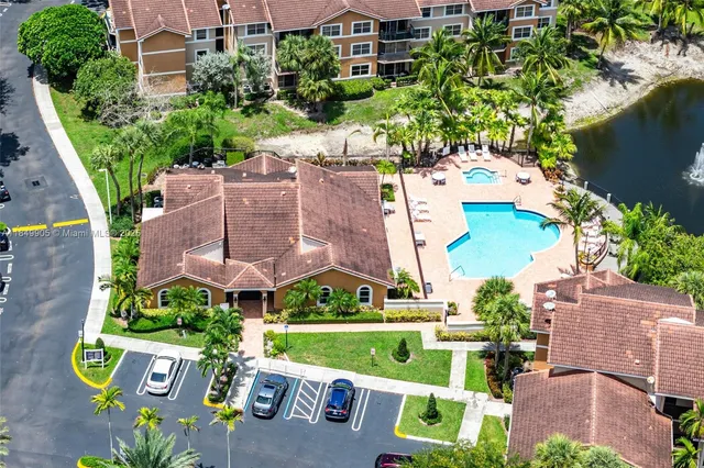 a view of a patio with a table chairs and a backyard