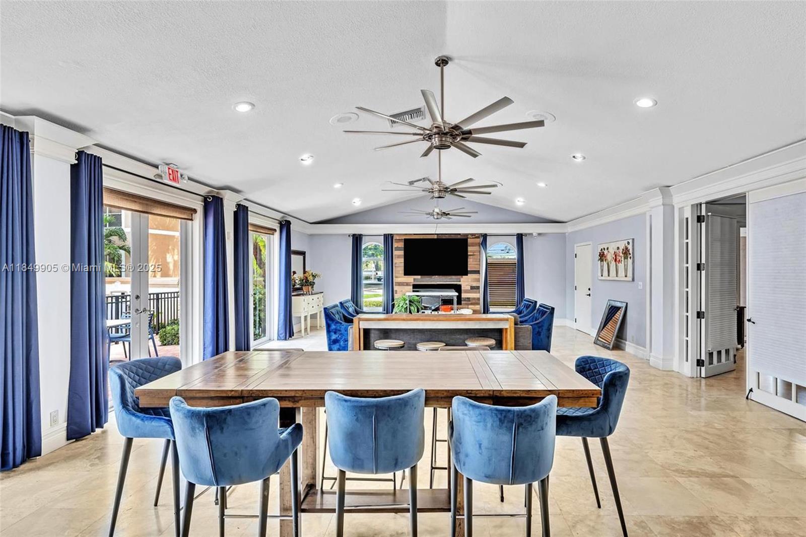 8721 Wiles Road, Unit 105 Coral Springs, FL 33067 - Photo 48 of 49 a view of a dining room with furniture window and wooden floor