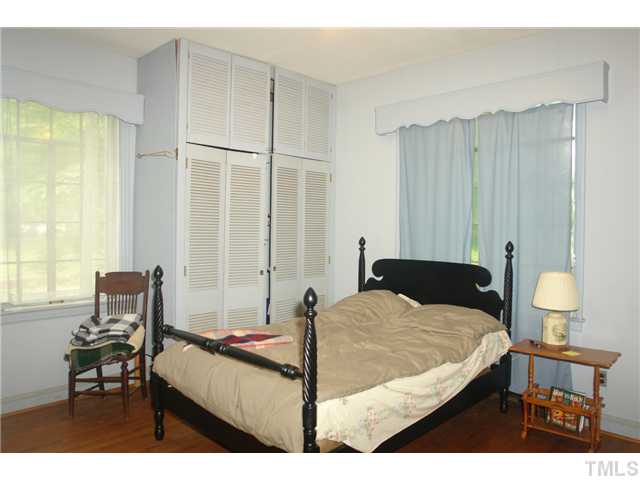 412 Dixie Trail Raleigh, NC 27607 - Photo 11 of 15 a bedroom with a bed and a table