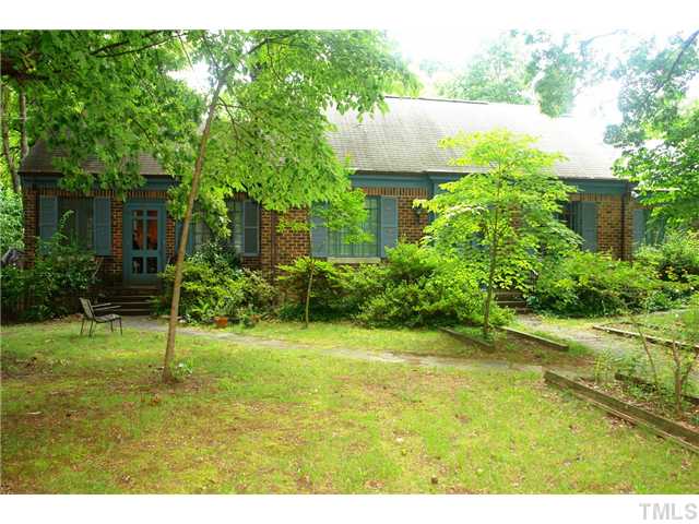 412 Dixie Trail Raleigh, NC 27607 - Photo 2 of 15 a view of a garden with a fountain