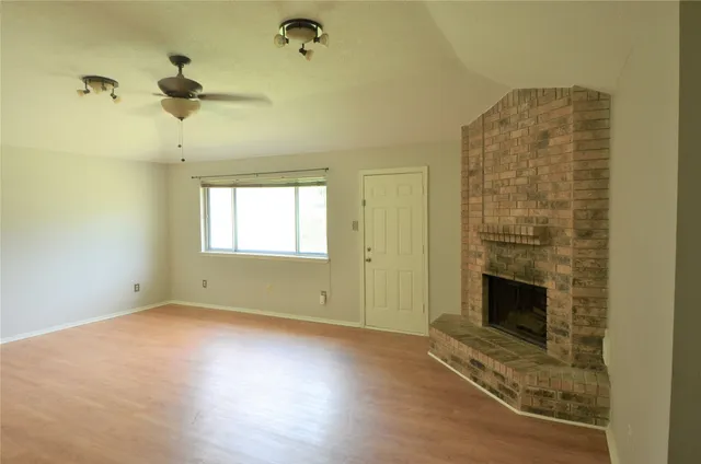 a view of livingroom with hardwood floor and a ceiling fan