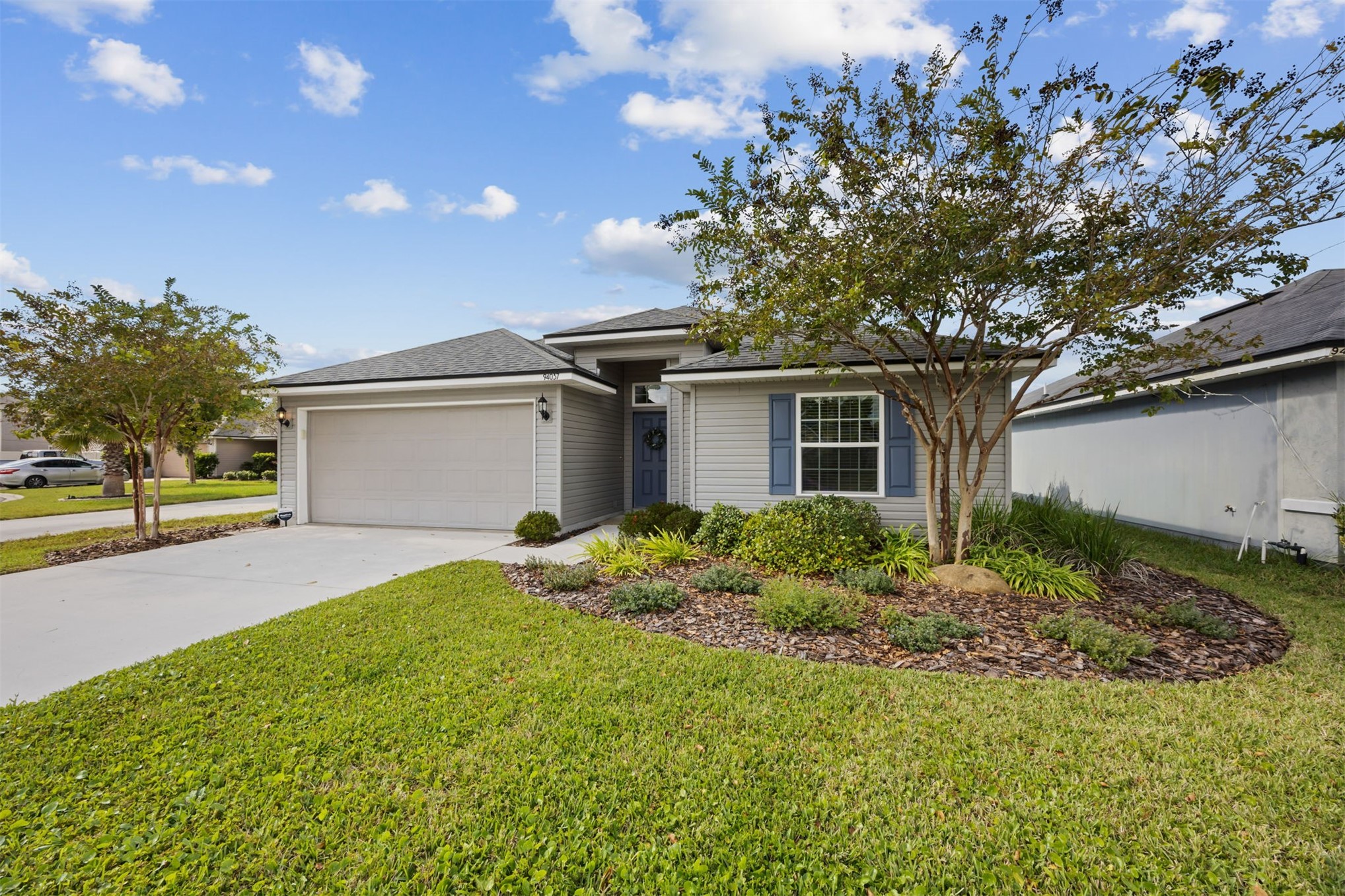 94037 Last Lane Yulee, FL 32097 - Photo 2 of 38 a view of backyard of house with green space