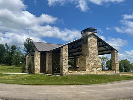 a view of a patio with a table and chairs