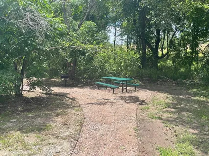 a view of a lake with houses in the back