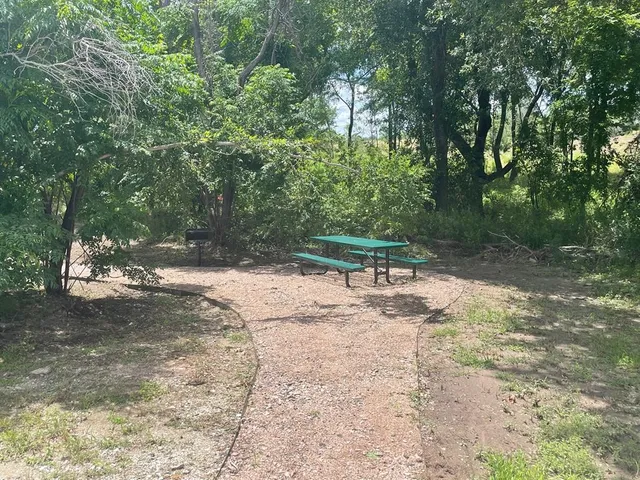 a view of a lake with houses in the back